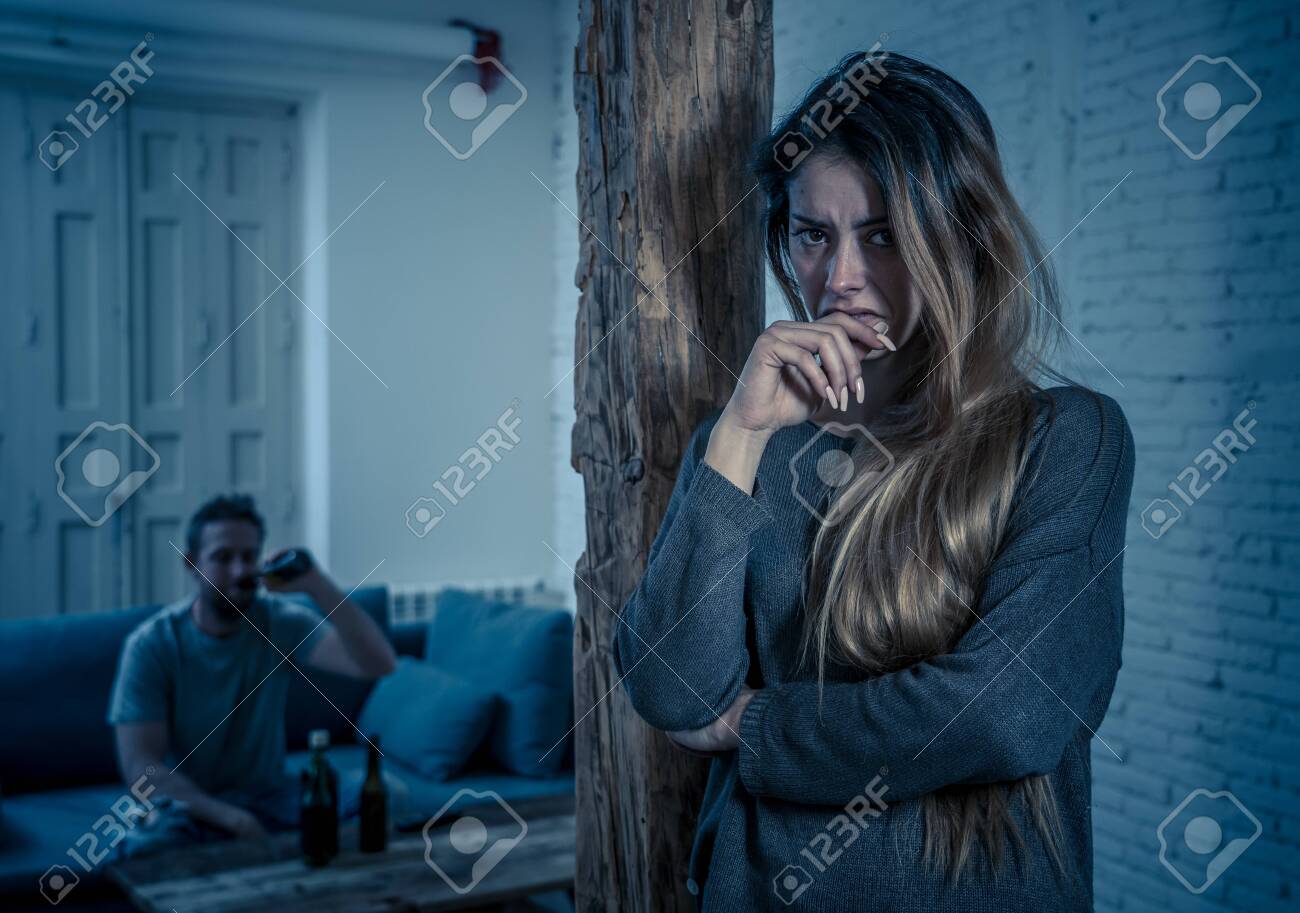 Social issues Domestic violence concept. Woman victim of spouse intimate abuse and physical aggression feeling hopeless and scared crying in distress powerless to stop violence.